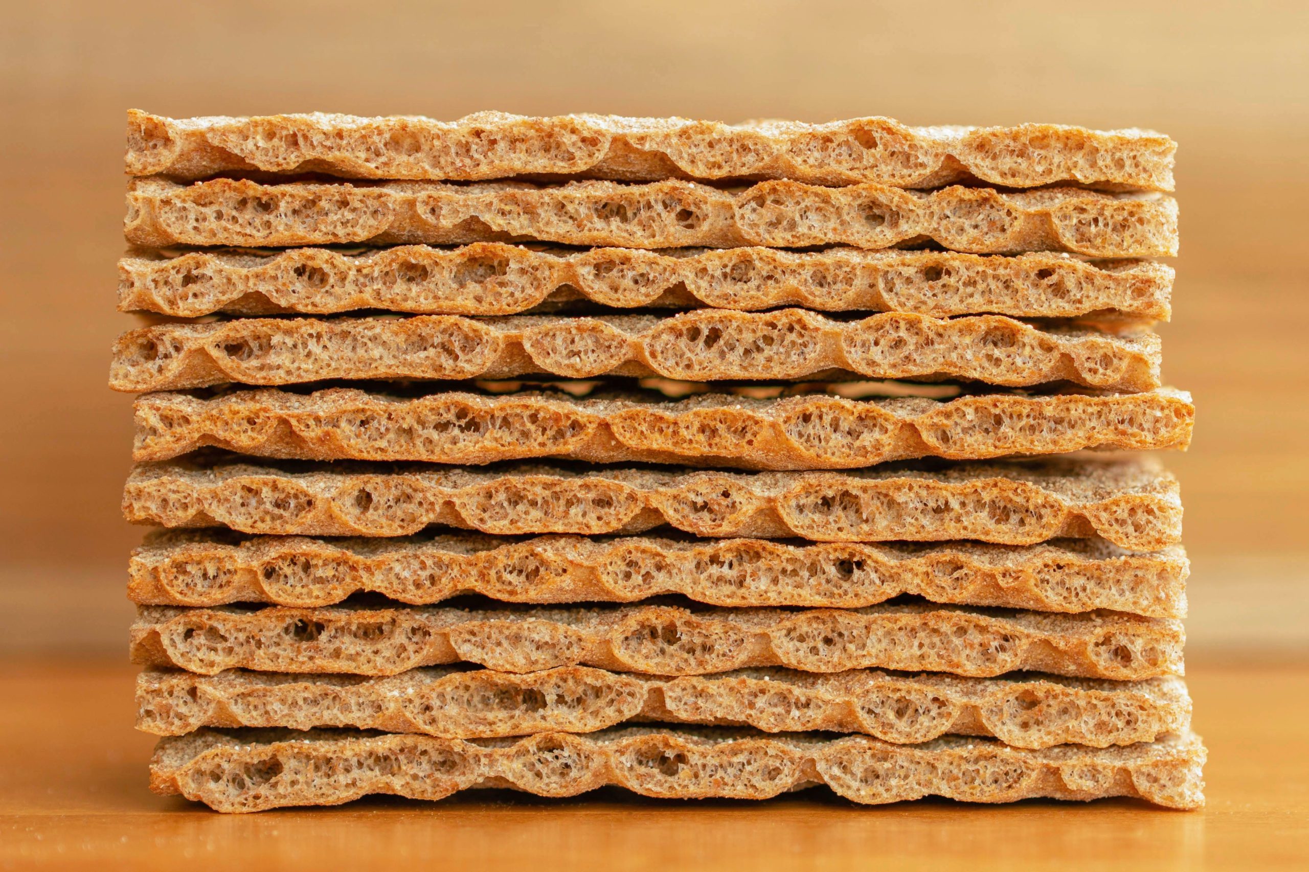 Close-up of stacked whole grain crispbread, perfect for healthy snacks and diet plans.